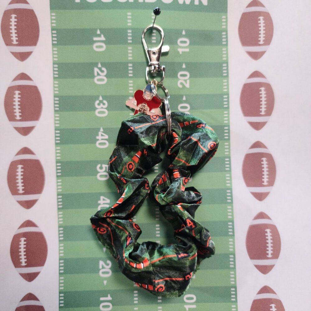 Football Themed Wristlet Keyring with a Football related charm attached !!